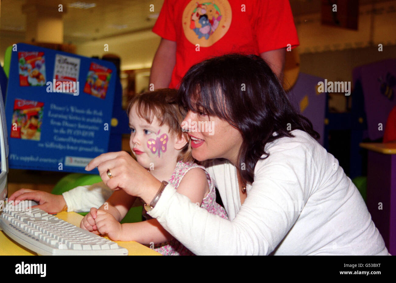 Comedienne and author Arabella Weir and her two year old daughter Isabella, appearing at the 'Winnie the Pooh Friendship Celebration', at Selfridges department store on Oxford Street, in London. Stock Photo