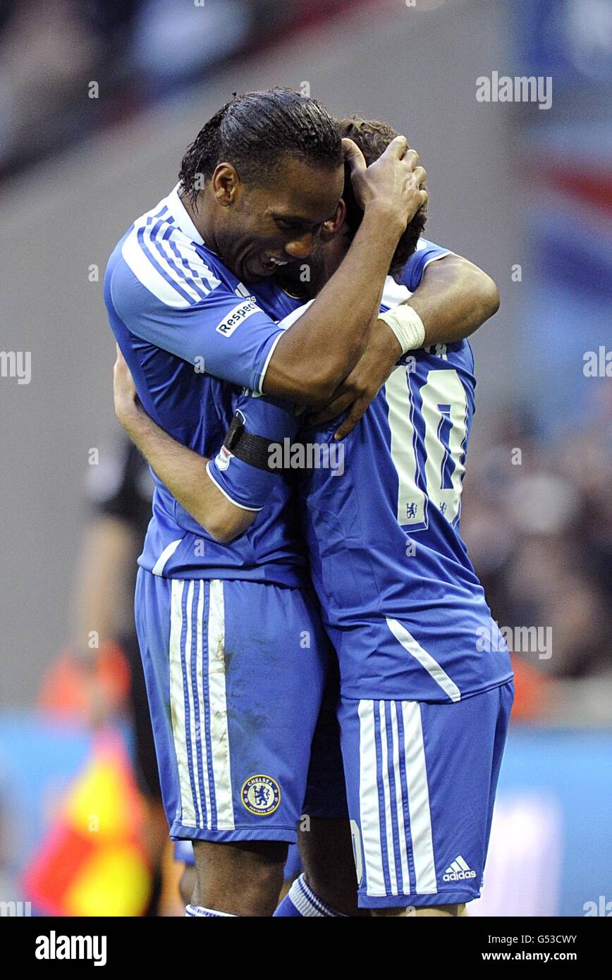 Chelsea's Juan Mata (right) celebrates with his team-mate Didier Drogba (left) after scoring his team's second goal Stock Photo