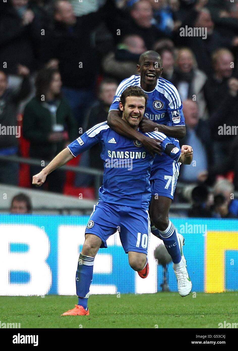 Chelsea's Juan Mata (left) celebrates scoring his side's second goal of the game with teammate Ramires Stock Photo