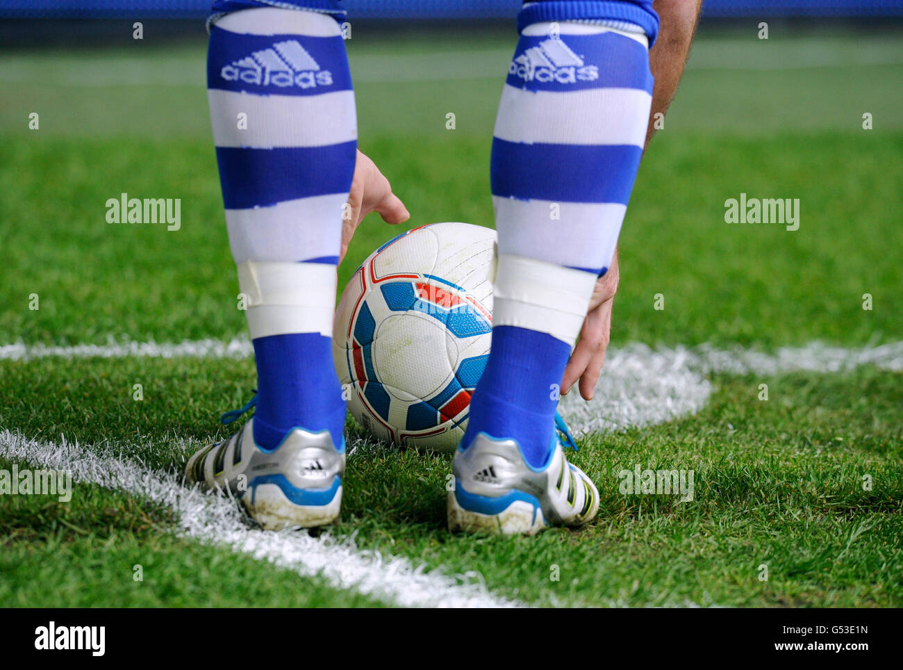 Player of FC Schalke 04 placing the ball inside the corner flag markings during the match between FC Schalke 04 and Borussia Stock Photo