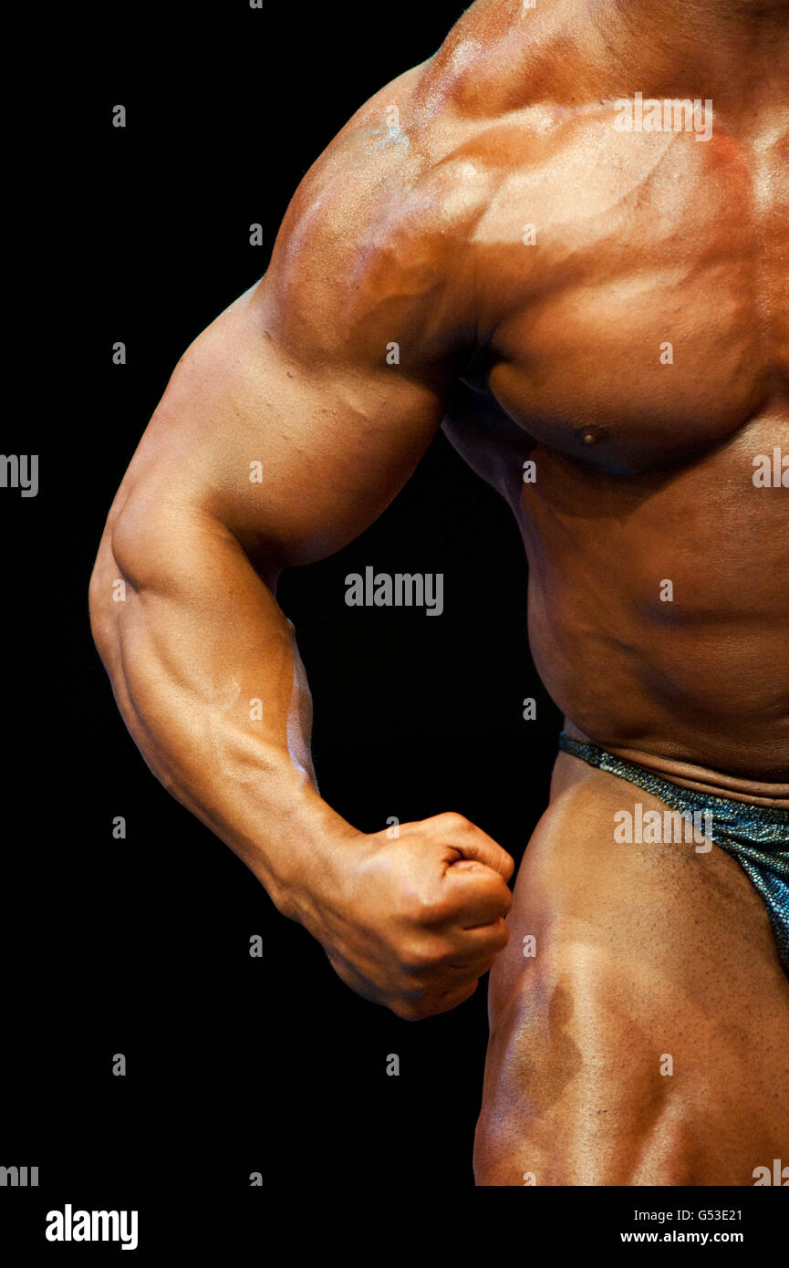 Arm, upper body of a bodybuilder at a bodybuilding show, FIBO Power 2012 fitness fair, Essen, North Rhine-Westphalia Stock Photo