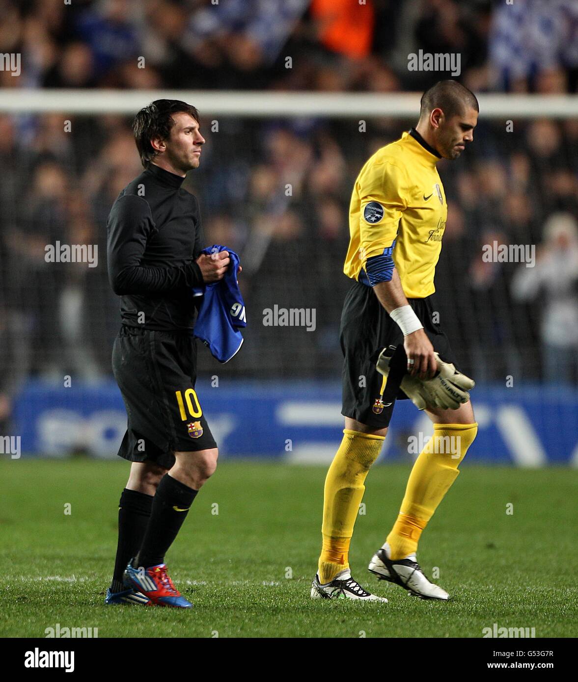 Barcelona's Lionel Messi (left) and Barcelona goalkeeper Victor Valdes looks dejected after the game Stock Photo