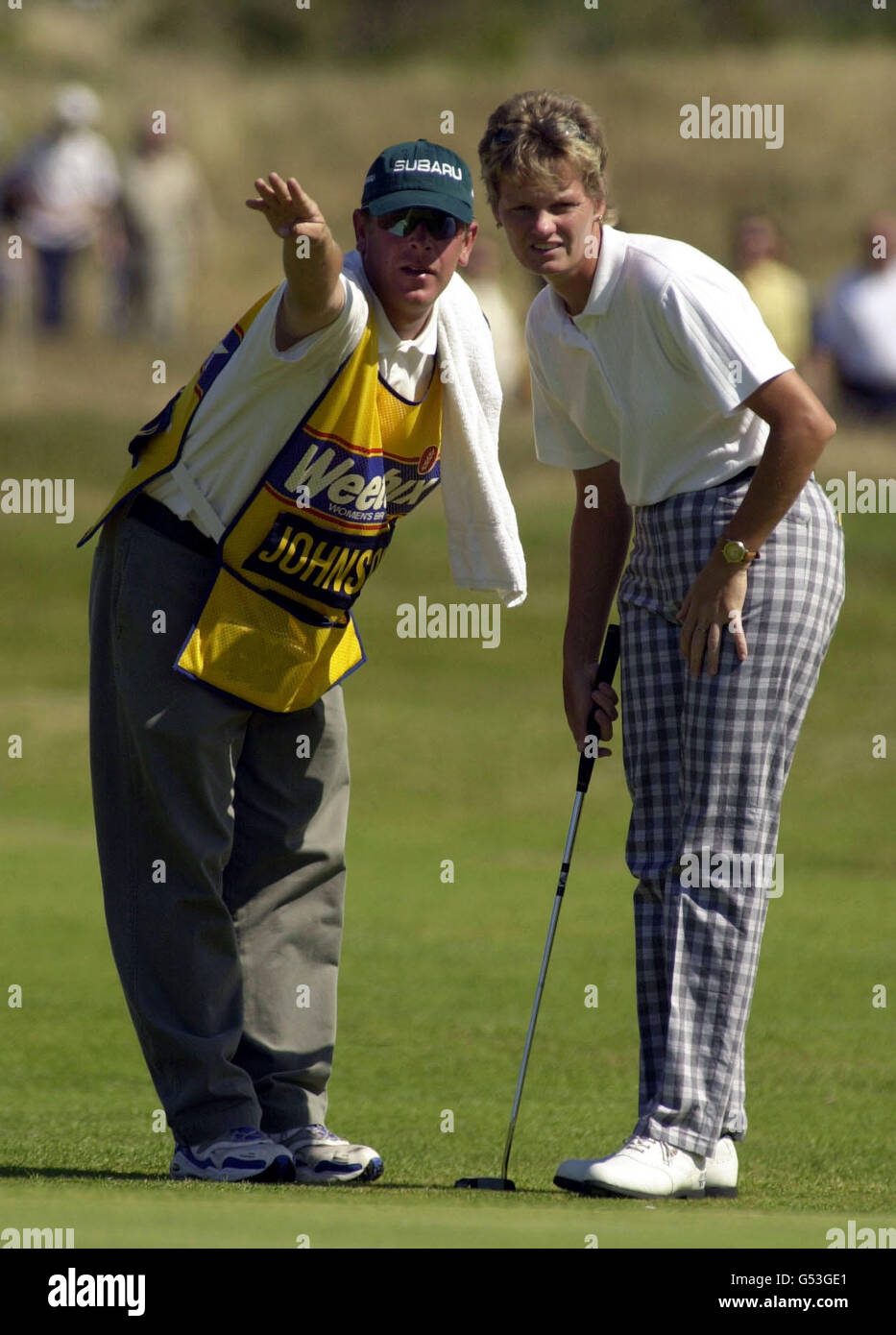 Trish Johnson and caddy consider options at the second hole during the Womens British Open at Southport. Stock Photo