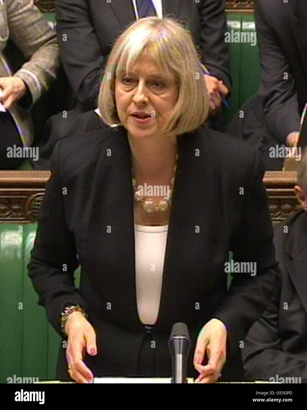 Home Secretary Theresa May explains to MPs in the House of Commons, the latest delay in the decade-long effort to deport terror suspect Abu Qatada. Stock Photo
