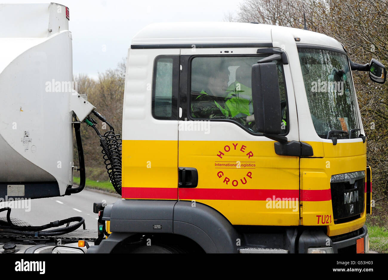 A man in military uniform drives a petrol tanker at Kingsbury Depot