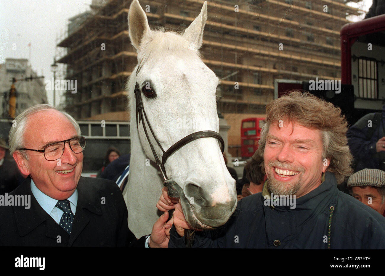 Entrepreneur Richard Branson (R) and Lord Young enlist the help of National Hunt Champion race horse Desert Orchid to deliver their application to run the National Lottery, at the Heritage Office in central London. Stock Photo
