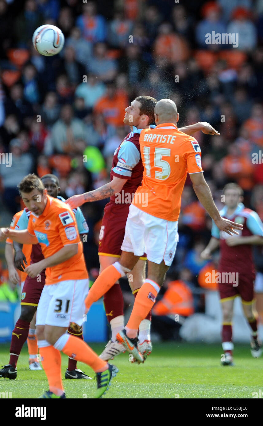 Blackpool's Alex Baptiste and Burnley's Chris McCann contest a header