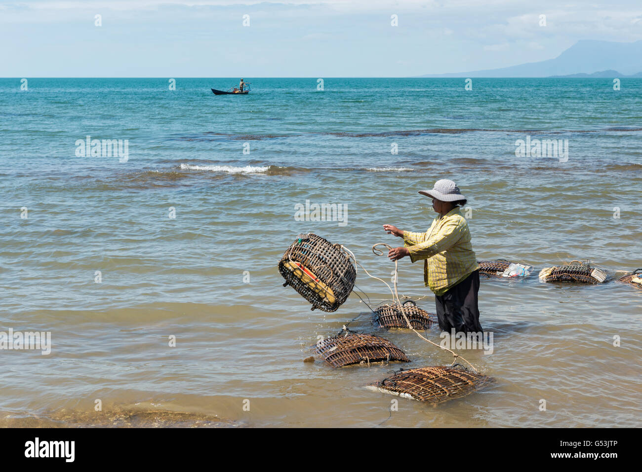 Crab fishing in front of the Crab Market in Kep. Stock Photo