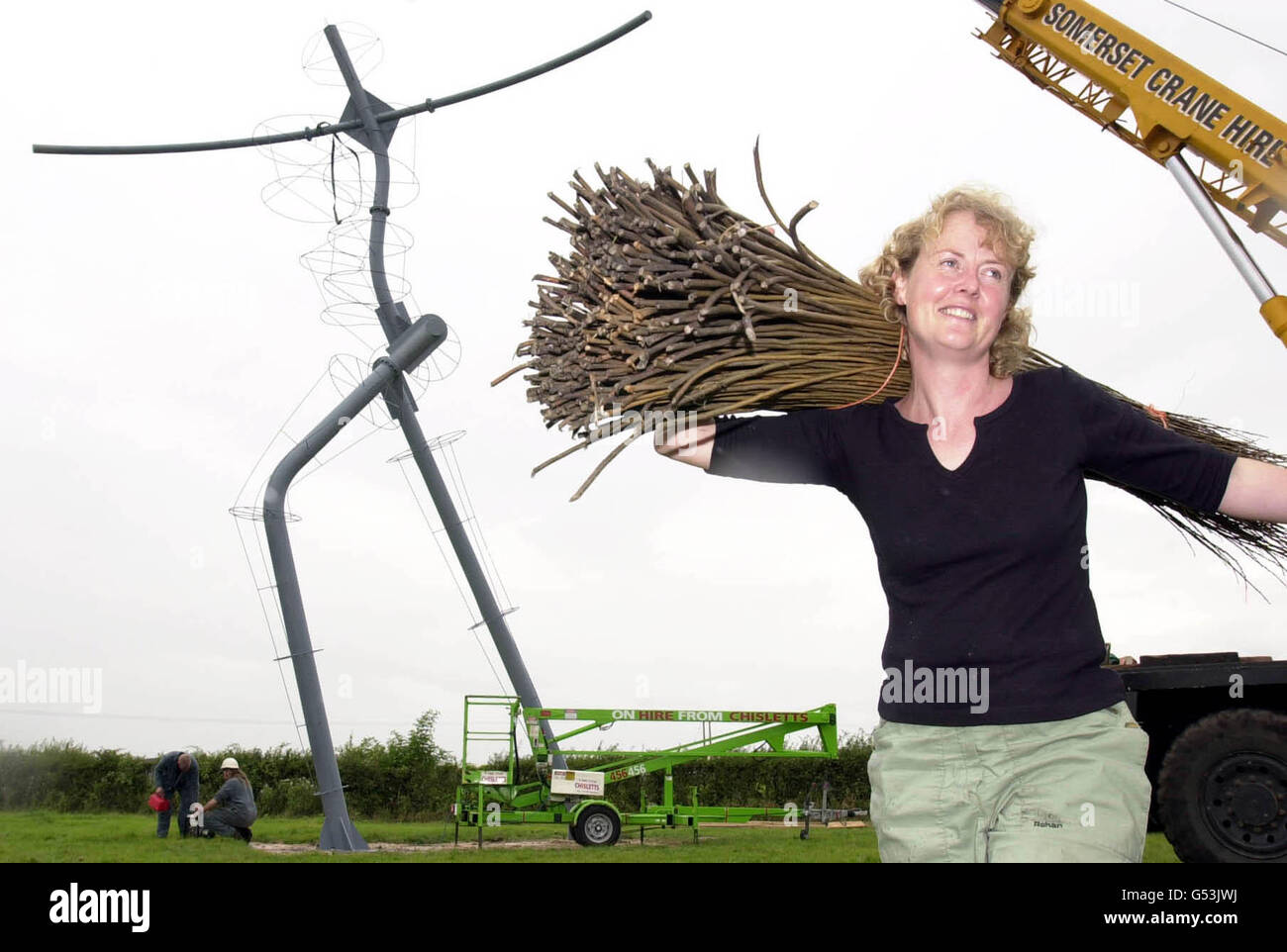 Artist Serena de la Hey stands in front of her framework for a huge willow sculpture, dubbed the Colossus of the West next to the M5 motorway. The giant sculpture of a running figure was put up as part of the Year of the Artist in the South West. * ...and can be seen from the M5 near Bridgwater, Somerset, and from the nearby railway line. Local artist Serena will now complete the sculpture, which has been compared to the Angel of the North, by weaving locally grown willow around the metal framework. Stock Photo