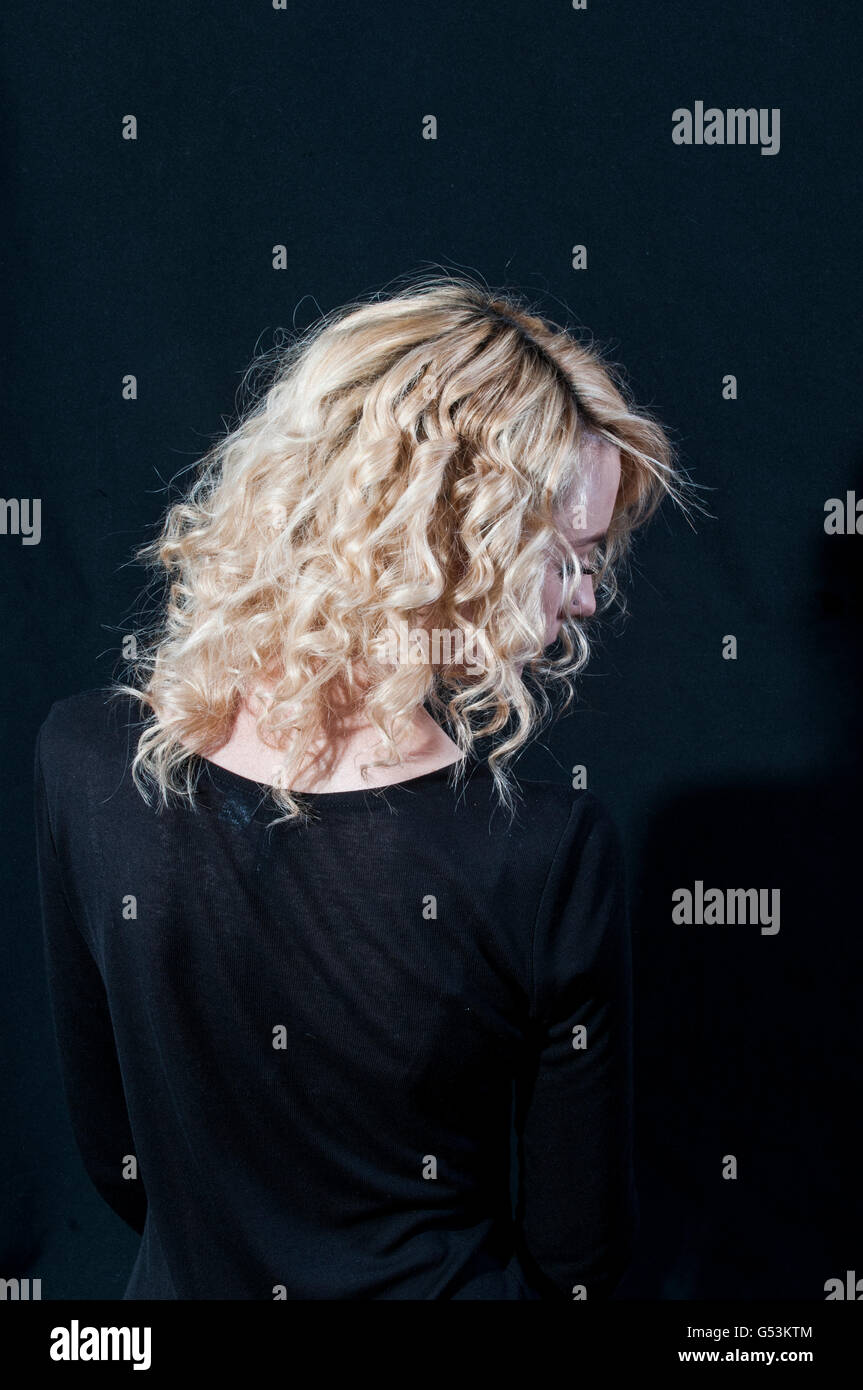 Rear view of a blond woman Stock Photo - Alamy