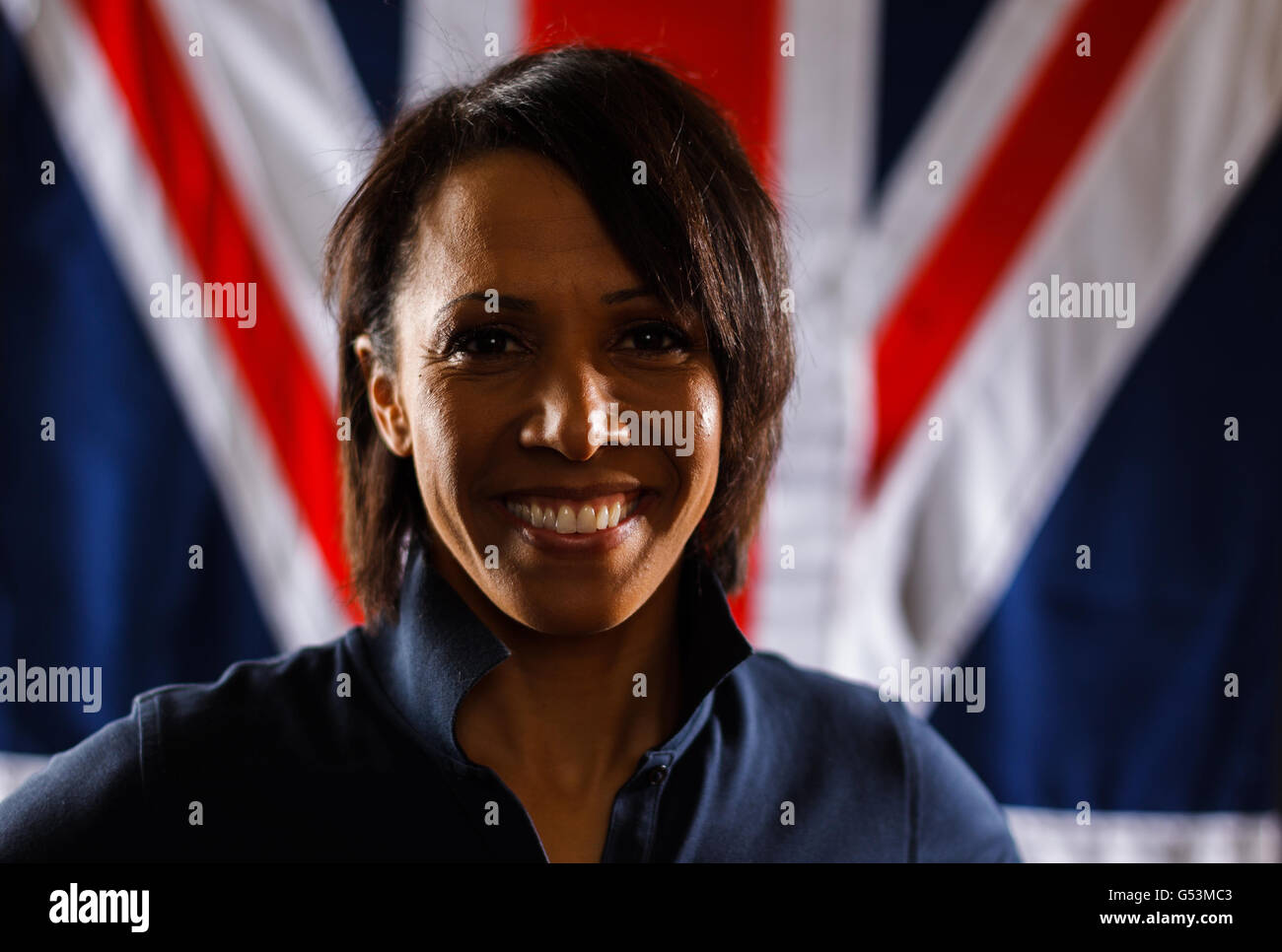 Double Olympic gold medalist Dame Kelly Holmes poses for photographers following a motivational speech to athletes during a media day at Dartford Elite Performance Centre, Dartford. Stock Photo