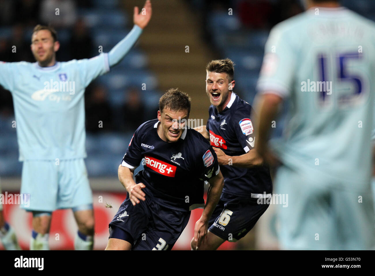 Soccer - npower Football League Championship - Coventry City v Millwall - Ricoh Arena. Millwall's Shane Lowry (centre left) celebrates scoring his sides opening goal Stock Photo