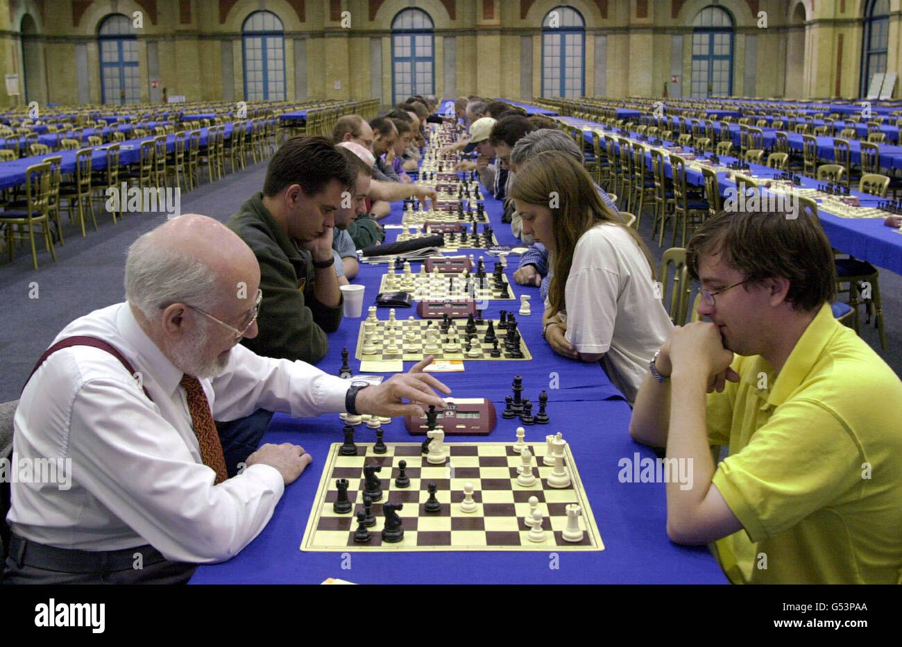 A picture of concentration for players involved in 'rapid chess' heats in the chess halls, at Alexandra Palace, North London. The 'Mind Sports Olympiad', at which over 5 000 'thinking athletes' compete in a variety of games. *... including chess, bridge, Go, poker, as well as the Creative Thinking Championship and the World Memory Championship.. Stock Photo