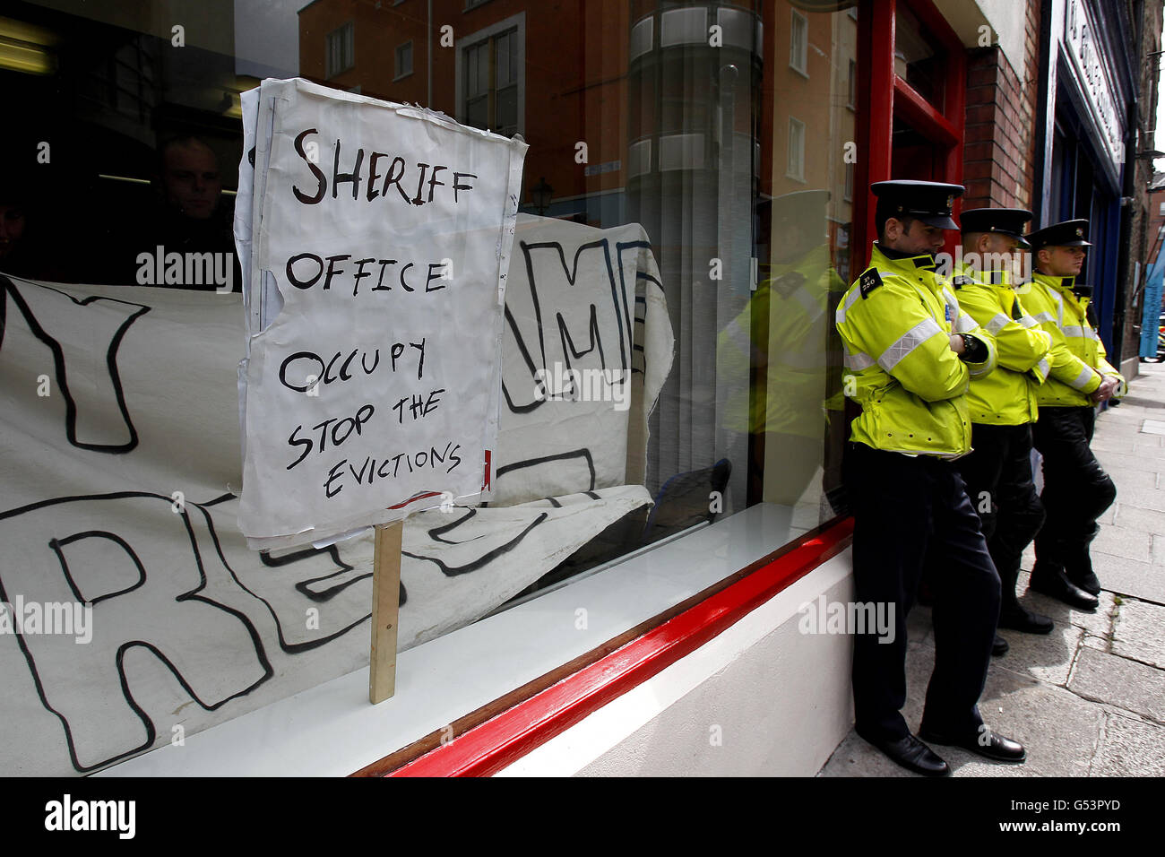 Members of Occupy Dame St occupy the offices of the Dublin Sherrif's offic on Fownes St,Temple Bar Dublin to protest against the eviction yesterday of Brendan and Asta Kelly from their home in Killiney, Co Dublin. Stock Photo