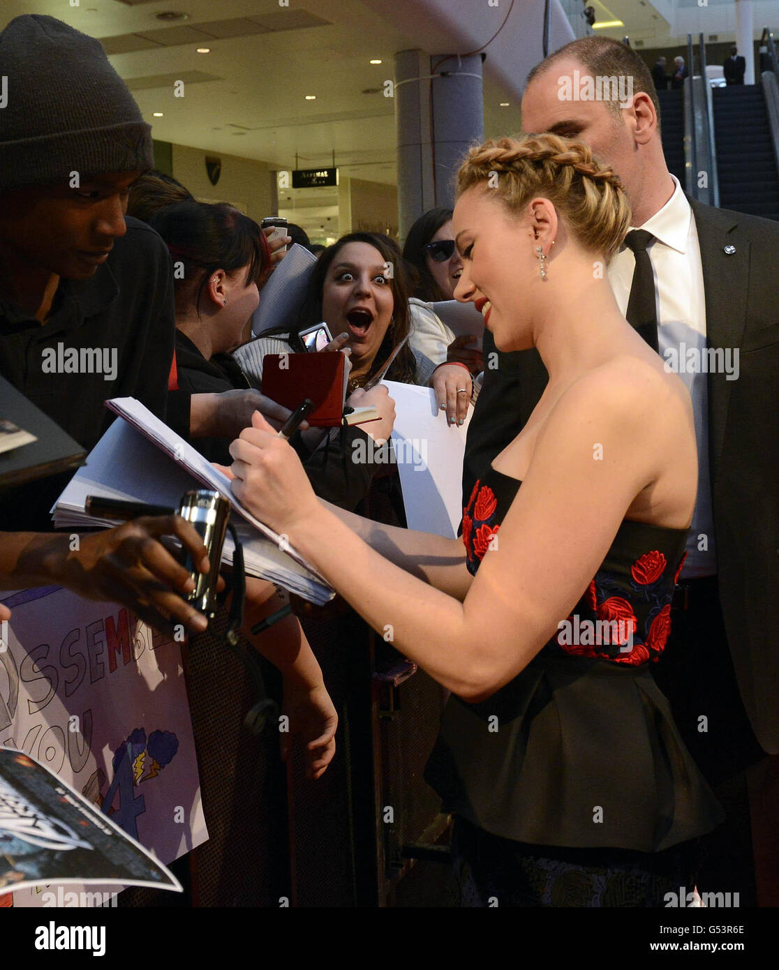 Scarlett Johansson signs autographs for fans at the Marvel Avengers  Assemble European Premiere at the Westfield Centre, London Stock Photo -  Alamy