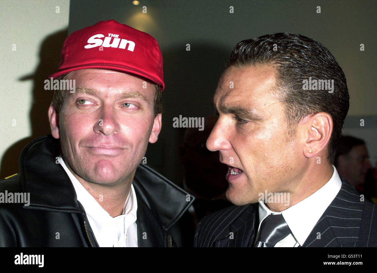 Former footballer turned actor Vinnie Jones (R), who stars in the film, meets Big Brother's Nasty Nick Bateman, while arriving at the premiere of Snatch, at the Odeon Leicester Square, in London. Stock Photo