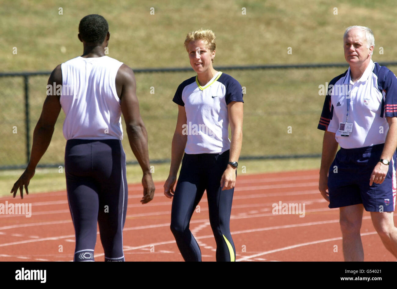 Athlete Katharine Merry (centre) speaks with coach Linford Christie before taking a Random Drugs Test at their Training Camp on Australia's Gold Coast, as Max Jones (right), the Performance Director for the Great Britain Athletics Team, looks on. * ...prior to the start of the Sydney 2000 Olympic Games. Stock Photo