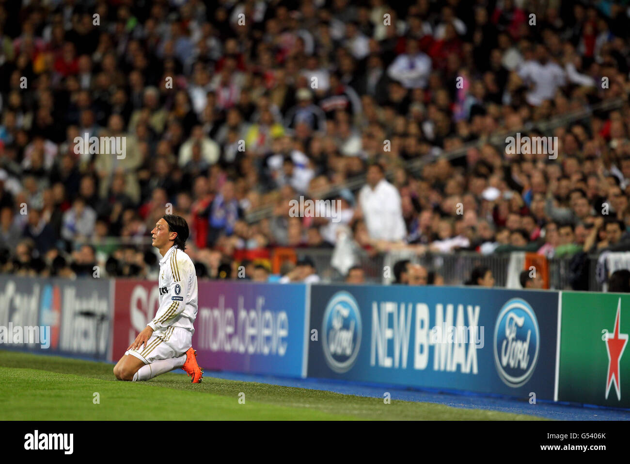Real Madrid's Mesut Ozil sits frustrated during the match Stock Photo