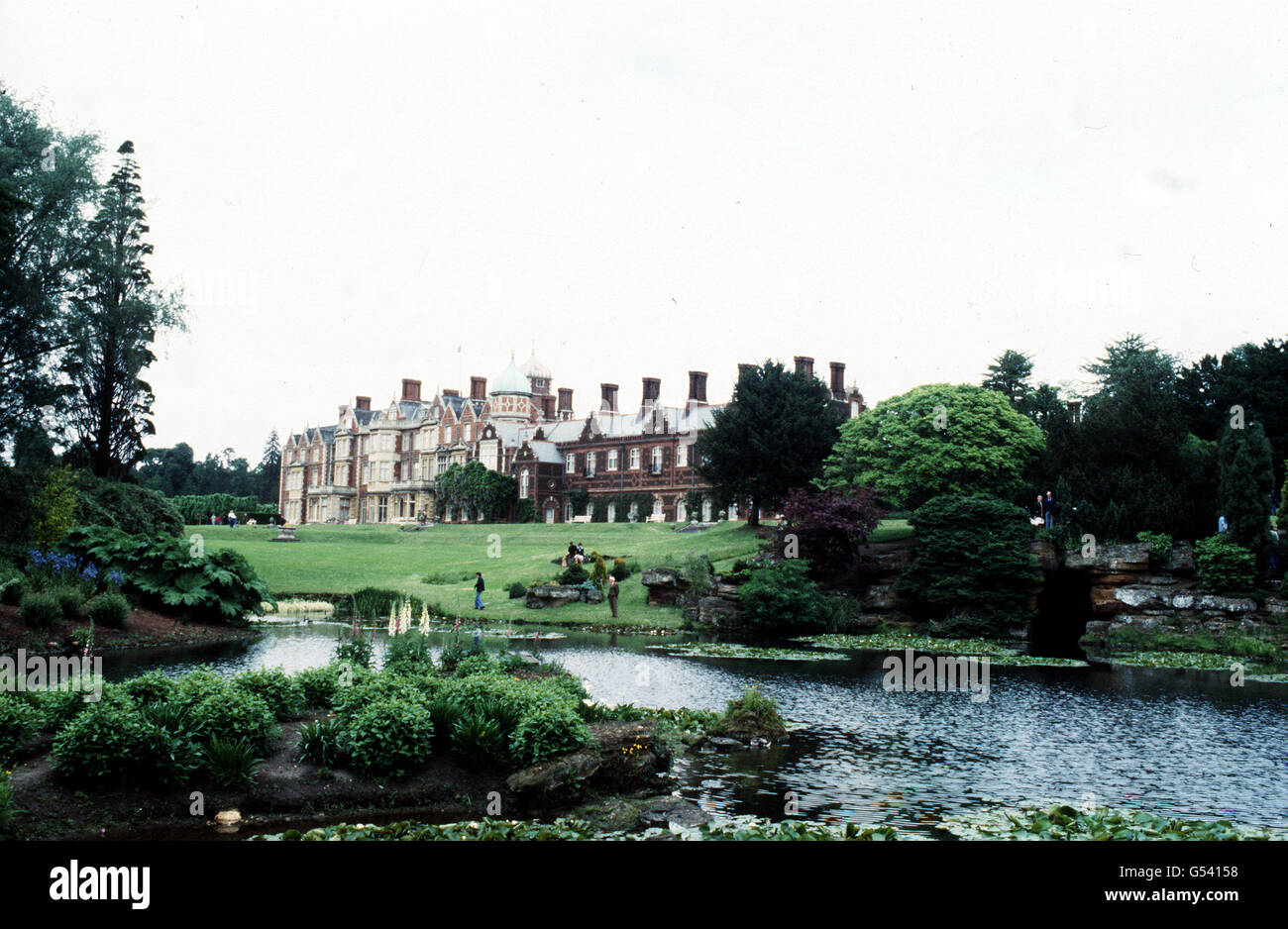 SANDRINGHAM : A view across the lake and gardens towards Sandringham House, Norfolk, a Royal residence since 1861. Stock Photo