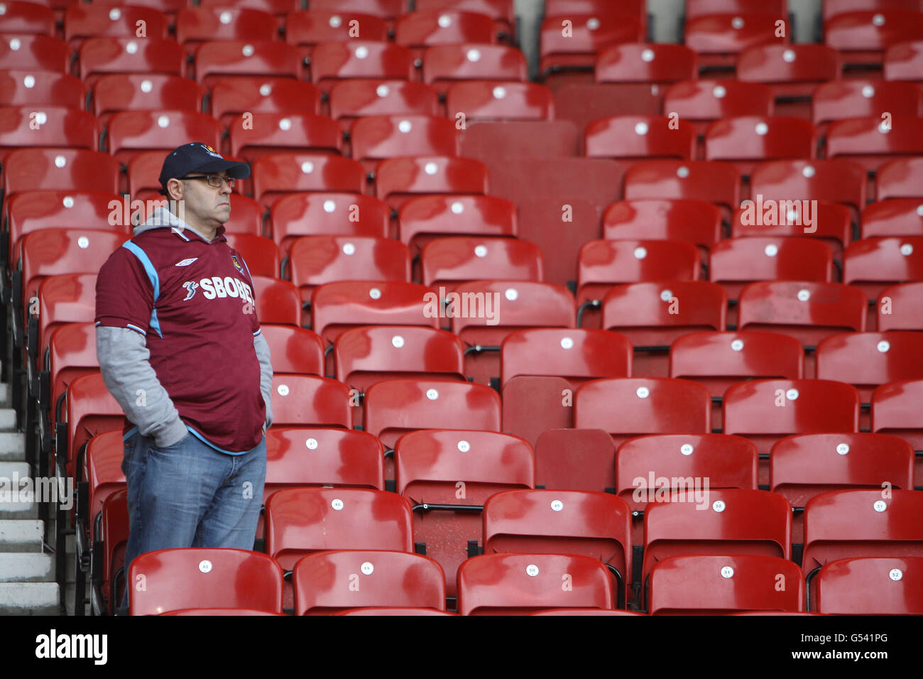 A West Ham United's fan show his dejection after 2.1 win over Hull City but knowing Southampton had gained automatic promotion during the npower Football League Championship match at Upton Park, London. Stock Photo