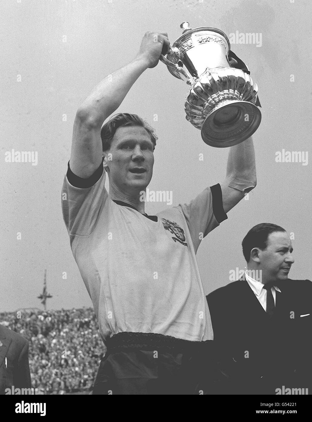 Bill Slater Wolverhamton captain and footballer of the yesr, happilly hold aloft the FA Cup at Wembley, London on the 7th of May 1960 after his team defeated Blackburn Rovers 3-0. Stock Photo