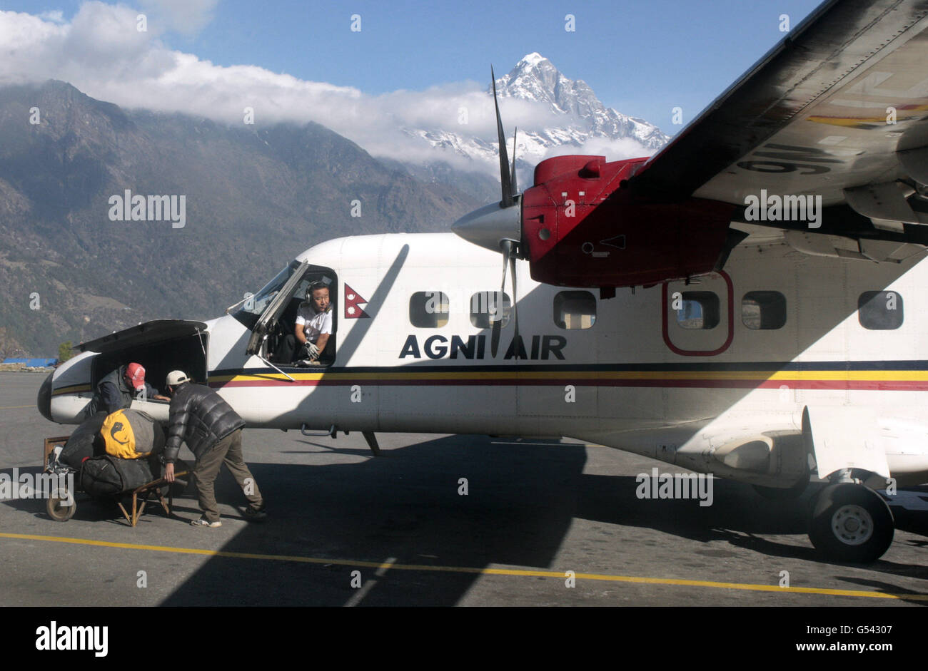 Lukla Airport renamed the Tenzing-Hillary Airport in 2008. Most climbers arrive there to start their trek to Everest Stock Photo