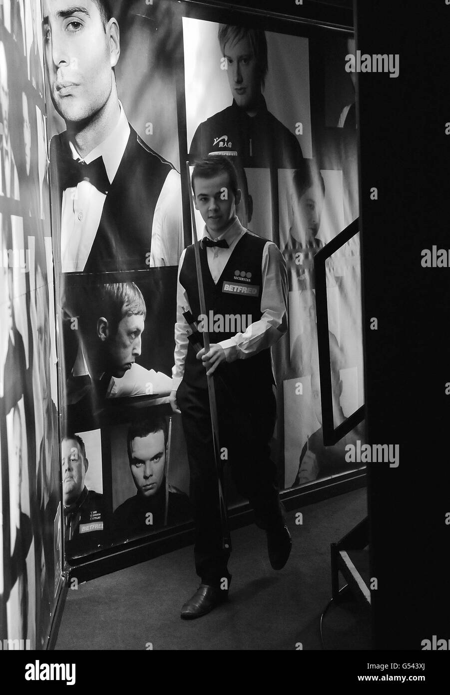 PICTURE CONVERTED TO BLACK AND WHITE Belgium's Luca Brecel enters the arena ahead of his first round match during the Betfred.com World Snooker Championships at the Crucible Theatre, Sheffield. Stock Photo