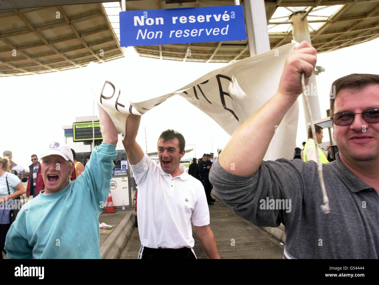 French fishermen celebrate a successful outcome to their dispute at the Channel Tunnel terminal outside Calais, France, during a protest over fuel prices. They ended their blockade after reports that the Paris government had agreed to a reduction. * ...in the price of fuel. Stock Photo