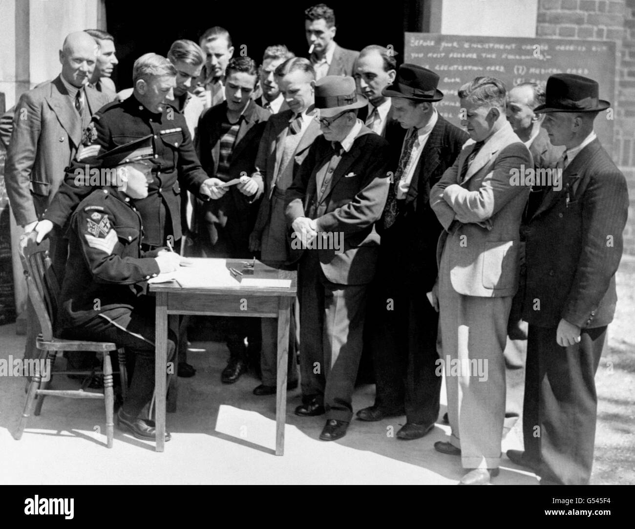 Some of the applicants who answered the British Army's call for volunteers with recruiting Sergeants at a West London recruiting office. Stock Photo