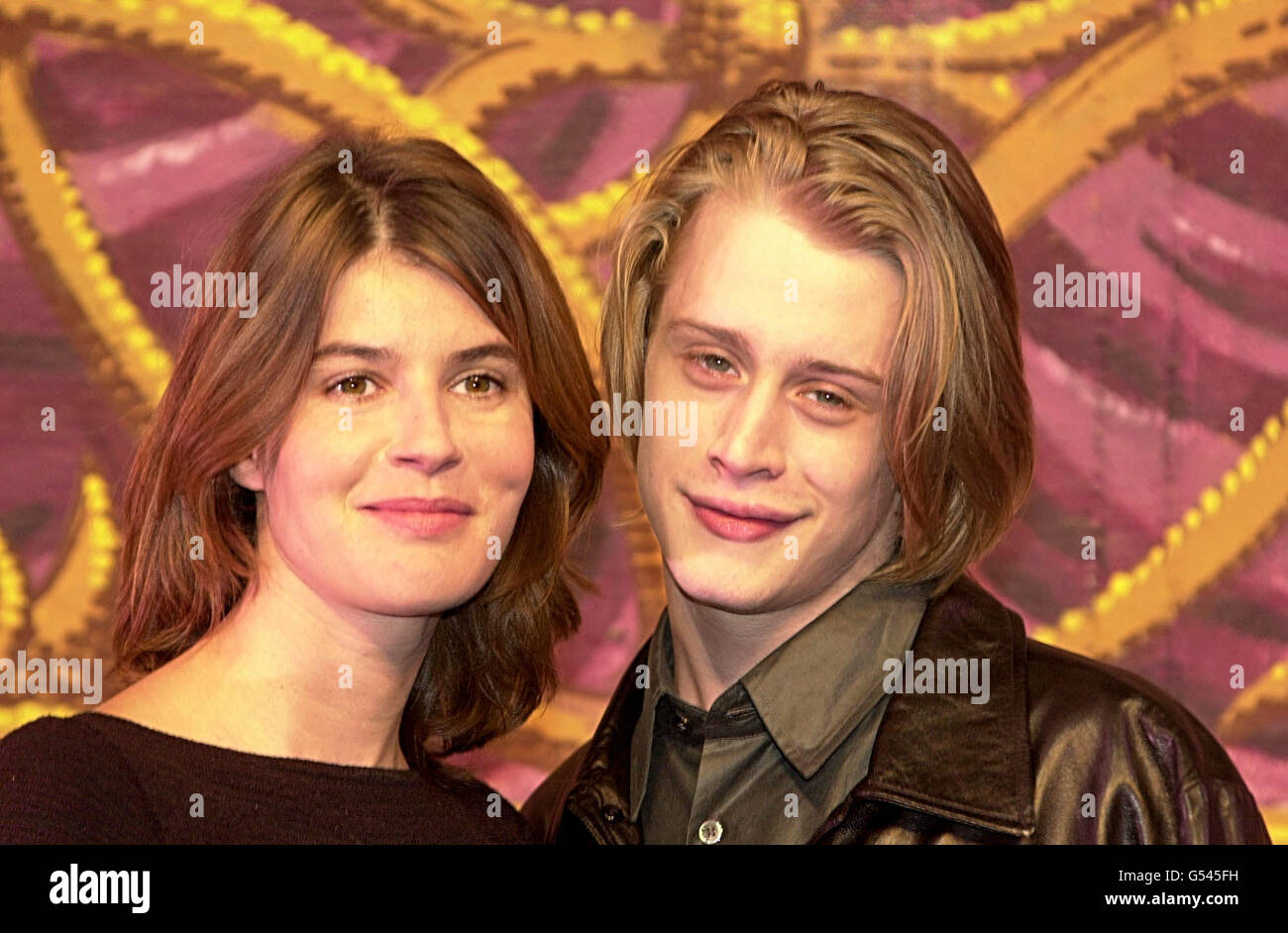 American actor Macaulay Culkin, who starred in the film Home Alone, with actress Irene Jacob at the Vaudeville Theatre in London. Culkin makes his West End acting debut in a new play by Richard Nelson, entitled Madam Melville. *... He plays Carl, a young American in Paris in 1966 who is seduced by the title character played by Jacobs. The play has its world premiere on October 18 2000. Stock Photo
