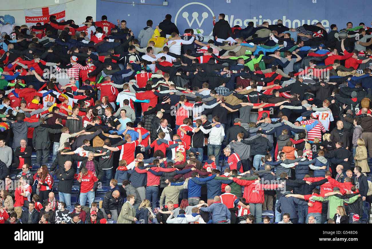 The Charlton Athletic fans celebrate their team's first goal by doing