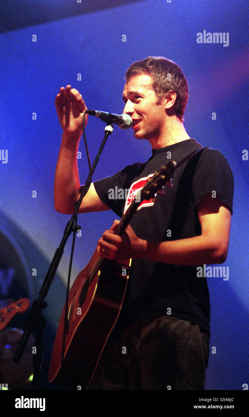 Coldplay band members performing live in *YEAR*