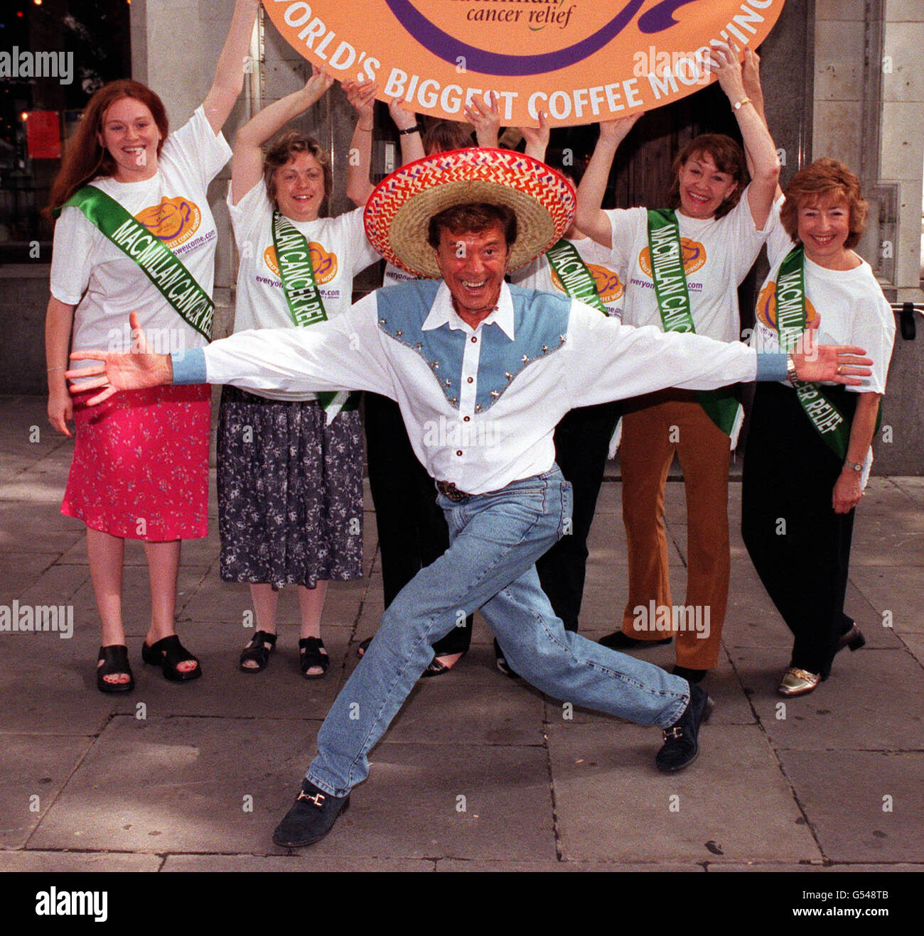 TV personality Lionel Blair (foreground) slips on his dancing shoes to  teach six Macmillan Cancer Relief nurses his specially created dance steps  in central London. * Blair recruited the cast of his