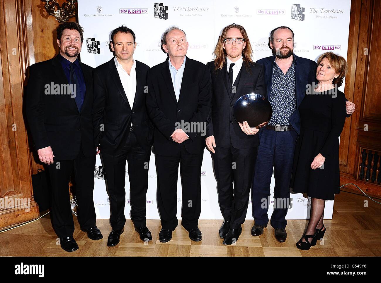 Matthew Warchus (second left), Michael Boyd (third left), Tim Minchin (third right) and Dennis Kelly (second right) with the Theatre award recieved for Matilda along side Michael Ball (left) and Imelda Staunton (right) at for the 2012 South Bank Sky Arts Awards at the Dorchester Hotel, Park Lane, London Stock Photo