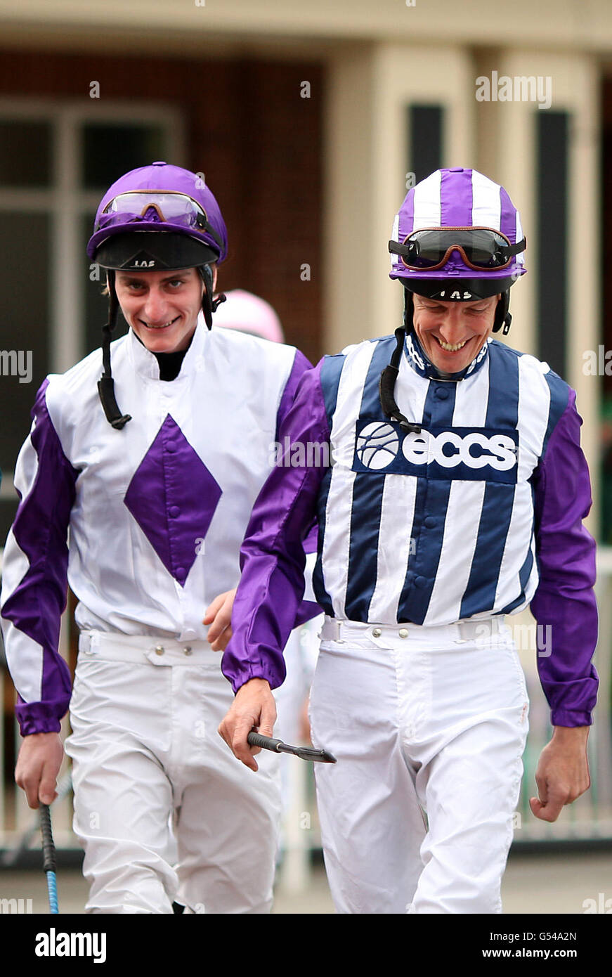 Jockey Richard Hughes (right) arrives at the parade ring to ride City