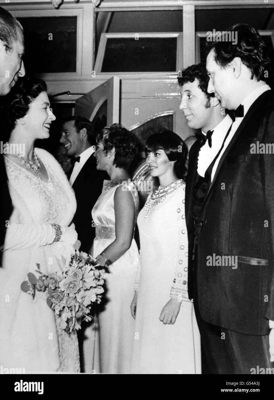 *Scanned low-res off print, high res available on request* Queen Elizabeth II talks to Welsh pop star Tom Jones at the Royal Variety Performance at the London Palladium. Stock Photo