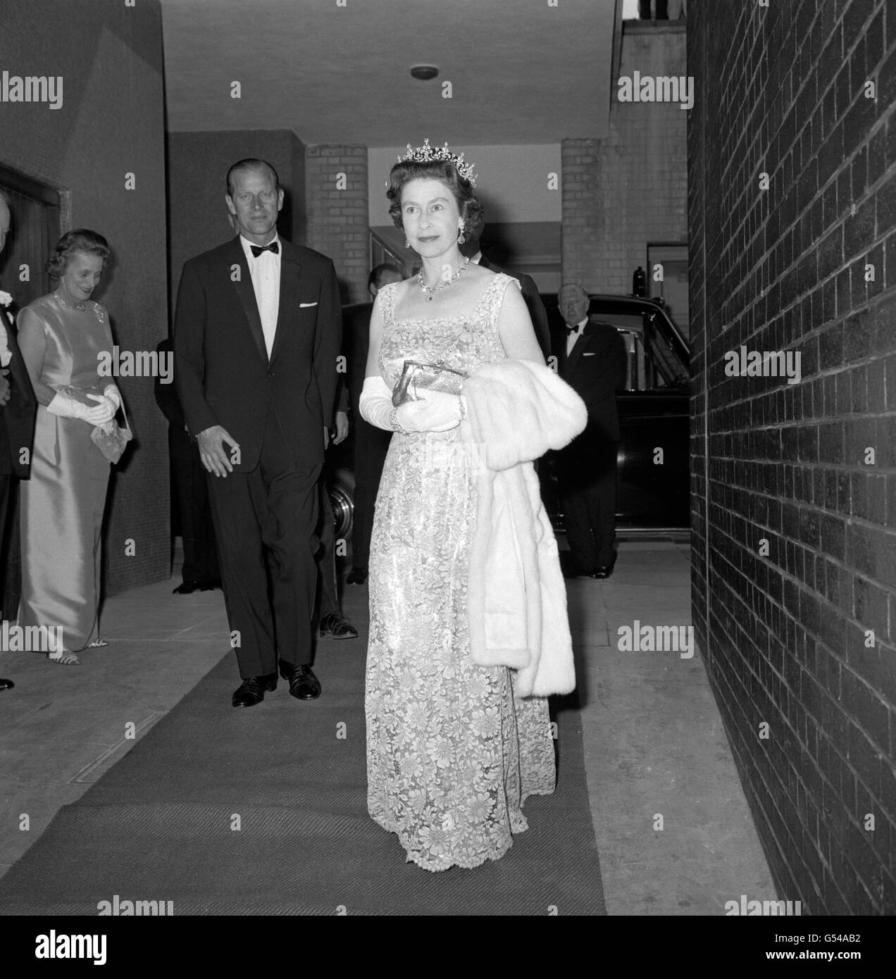 Queen Elizabeth II and the Duke of Edinburgh arriving at the Royal Festival Hall, London, to attend a concert given by the Council of Christians and Jews in celebration of the Council's 25th anniversary. Stock Photo