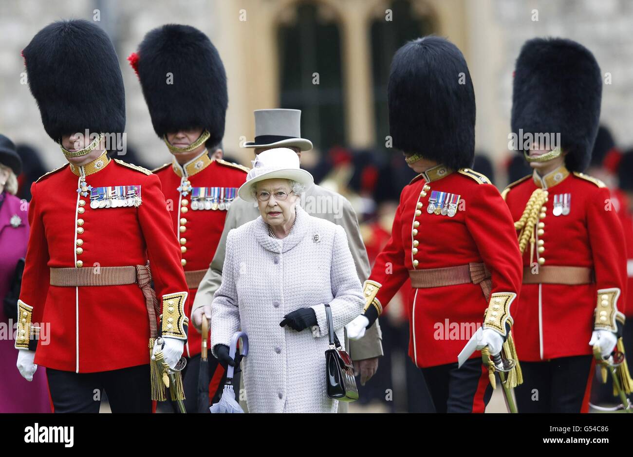 Queen Elizabeth II arrives to inspect the guards during a ceremony to present new colours to the