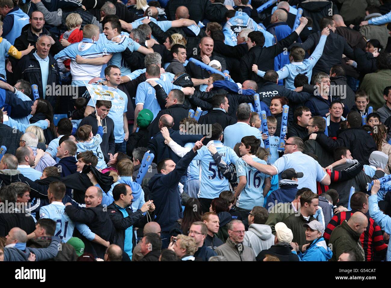 Manchester City fans celebrate by doing 'the Poznan' celebration in the  stands Stock Photo - Alamy
