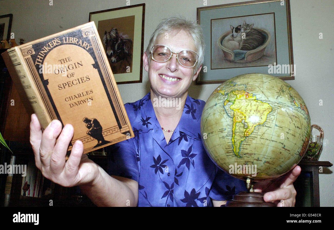 Kathy Bickerstaff, from Somerset, who bought a copy of The Origin of Species by Charles Darwin at a church fete back in 1988 for 50 pence never realising its true value. She is preparing to follow in the footsteps of Darwin after selling the rare first edition. * to pay for her trip. Here at home with another edition of the book. She will fulfil a dream she has had since a small girl when she travels to the Galapagos Islands in October 2000. Stock Photo