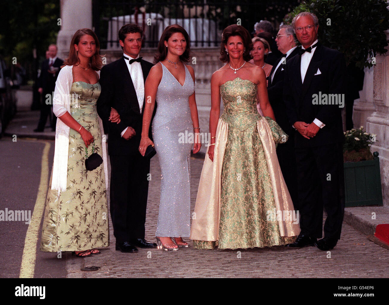 Queen Silvia, King Carl Gustaf of Sweden, their daughter Princess Victoria (c), their son, Prince Carl Philip and their younger daughter, Princess Madeleine, arrive at Bridgewater House in London before a ball two days before the wedding of Carlos Morales Quintana and Princess Alexia of Greece. Stock Photo