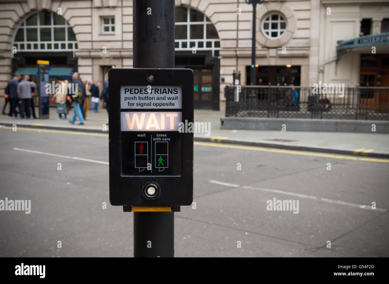 pedestrian button saying Wait in London, england Stock Photo