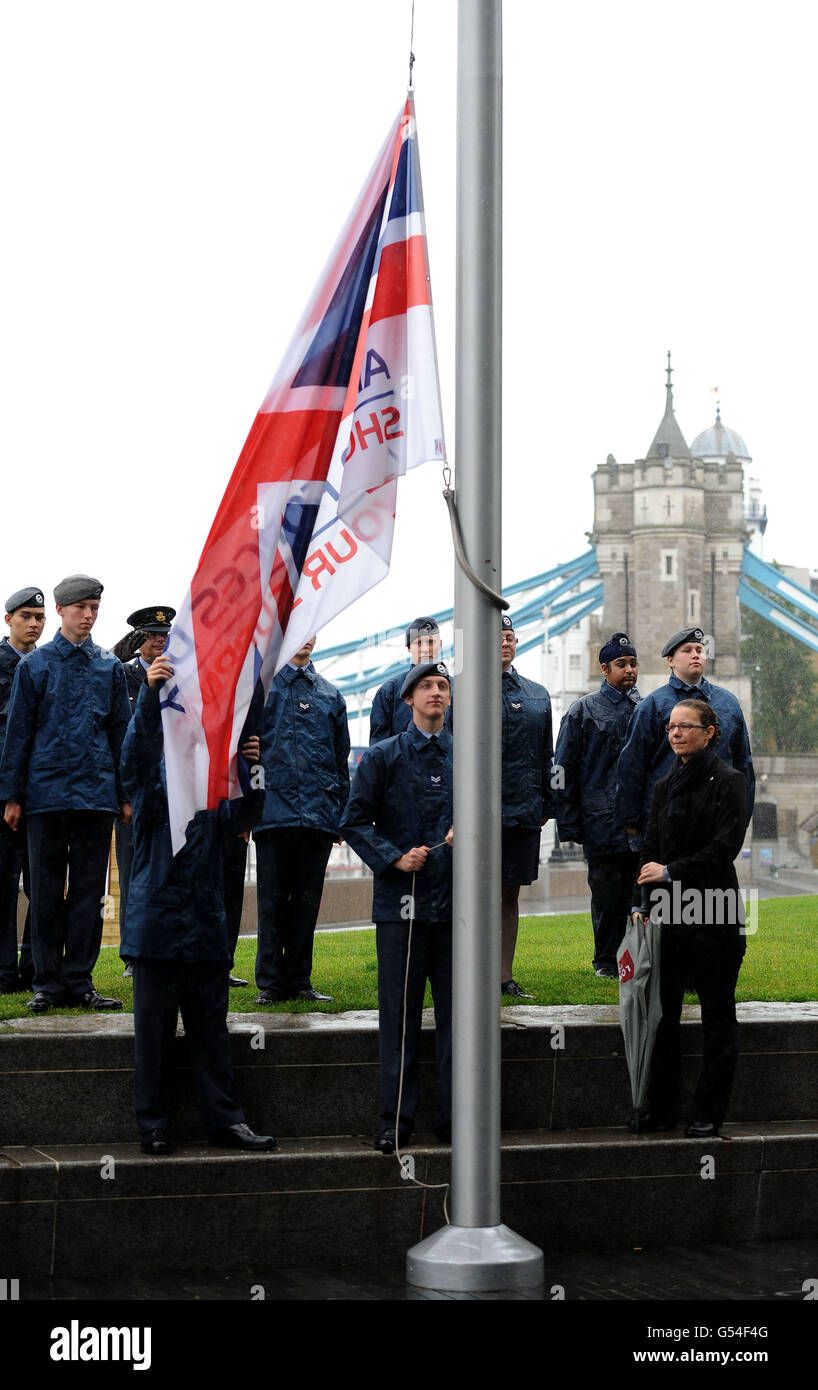 Cadets stand in the pouring rain as they raise the Armed Forces flag during a flag-raising ceremony at City Hall, London, to mark the start of a week of celebrations ahead of Armed Forces Day on June 25. Stock Photo