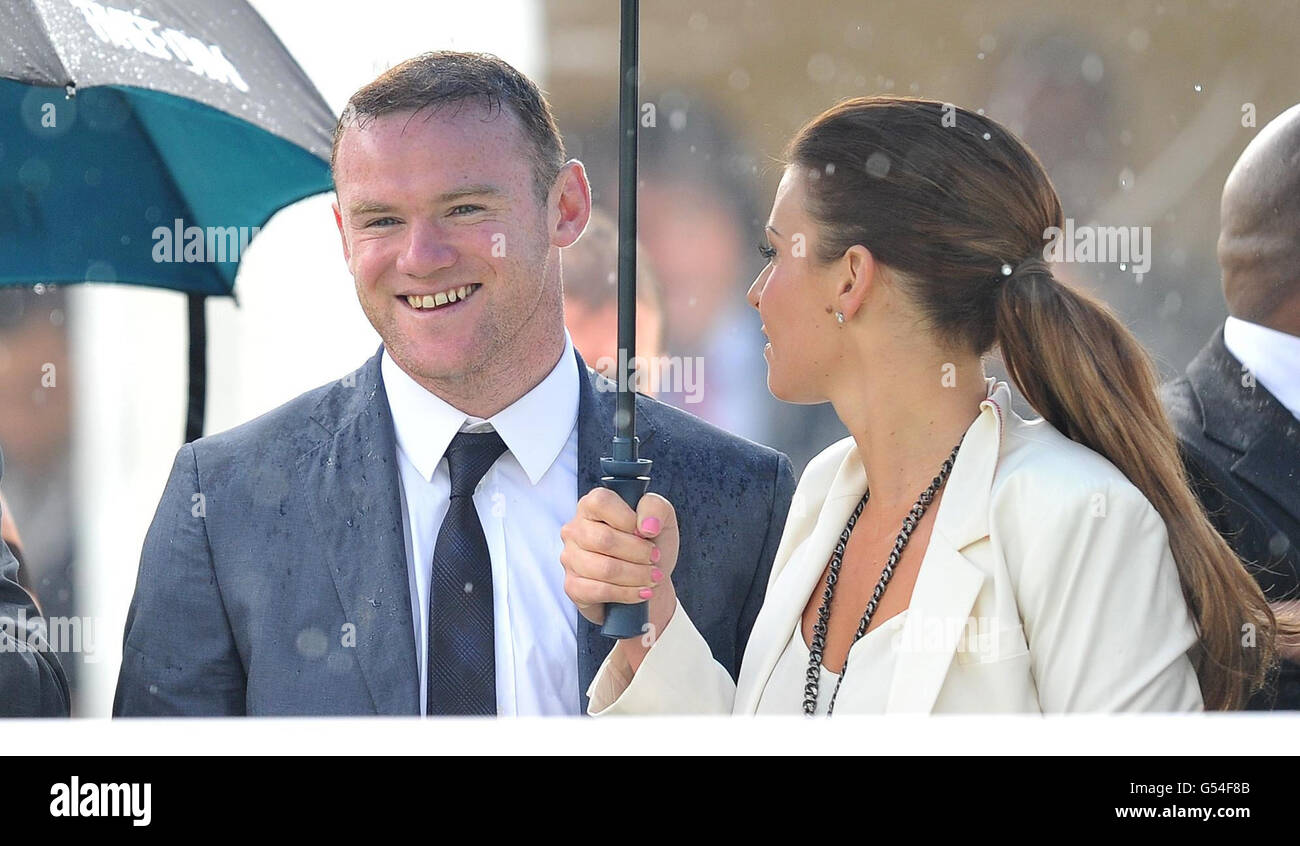 Wayne and Coleen Rooney watch The Manor House Stables Lily Agnes Conditions Stakes at Chester Races during the Stan James Cup Day during the May Festival at Chester Racecourse, Chester. Stock Photo