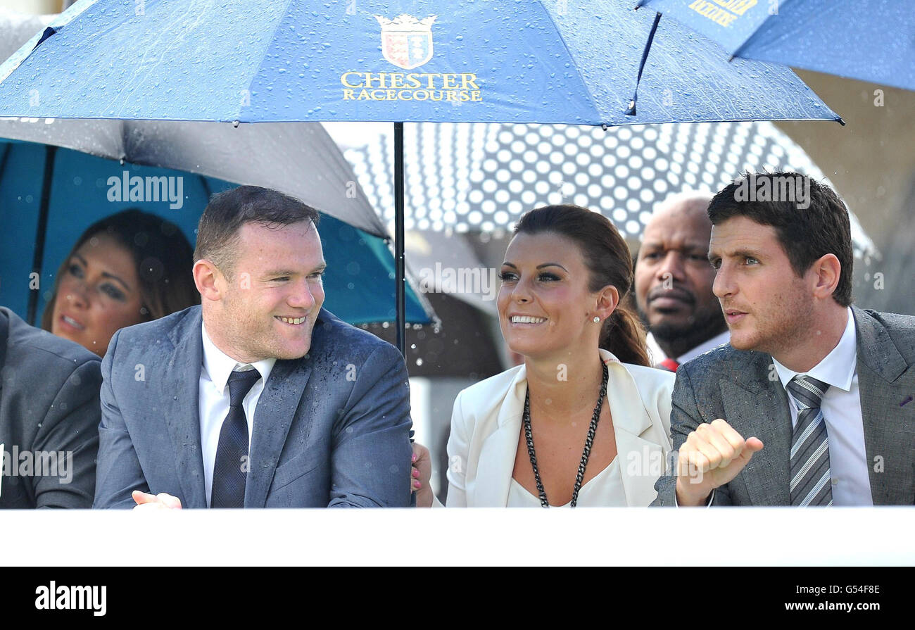 Wayne and Coleen Rooney watch The Manor House Stables Lily Agnes Conditions Stakes at Chester Races during the Stan James Cup Day during the May Festival at Chester Racecourse, Chester. Stock Photo