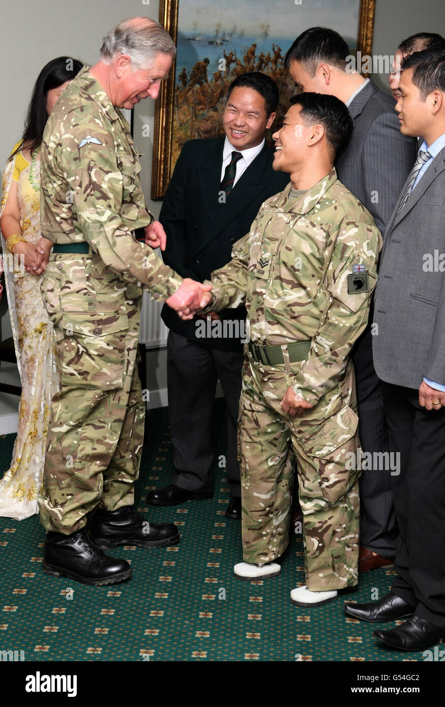 The Prince of Wales meets Corporal Harribahadar Budha, who lost his legs whilst on service in Afghanistan, during a visit to First Battalion The Royal Gurkha Rifles at Sir John Moore Barracks, in Folkestone, Kent. Stock Photo