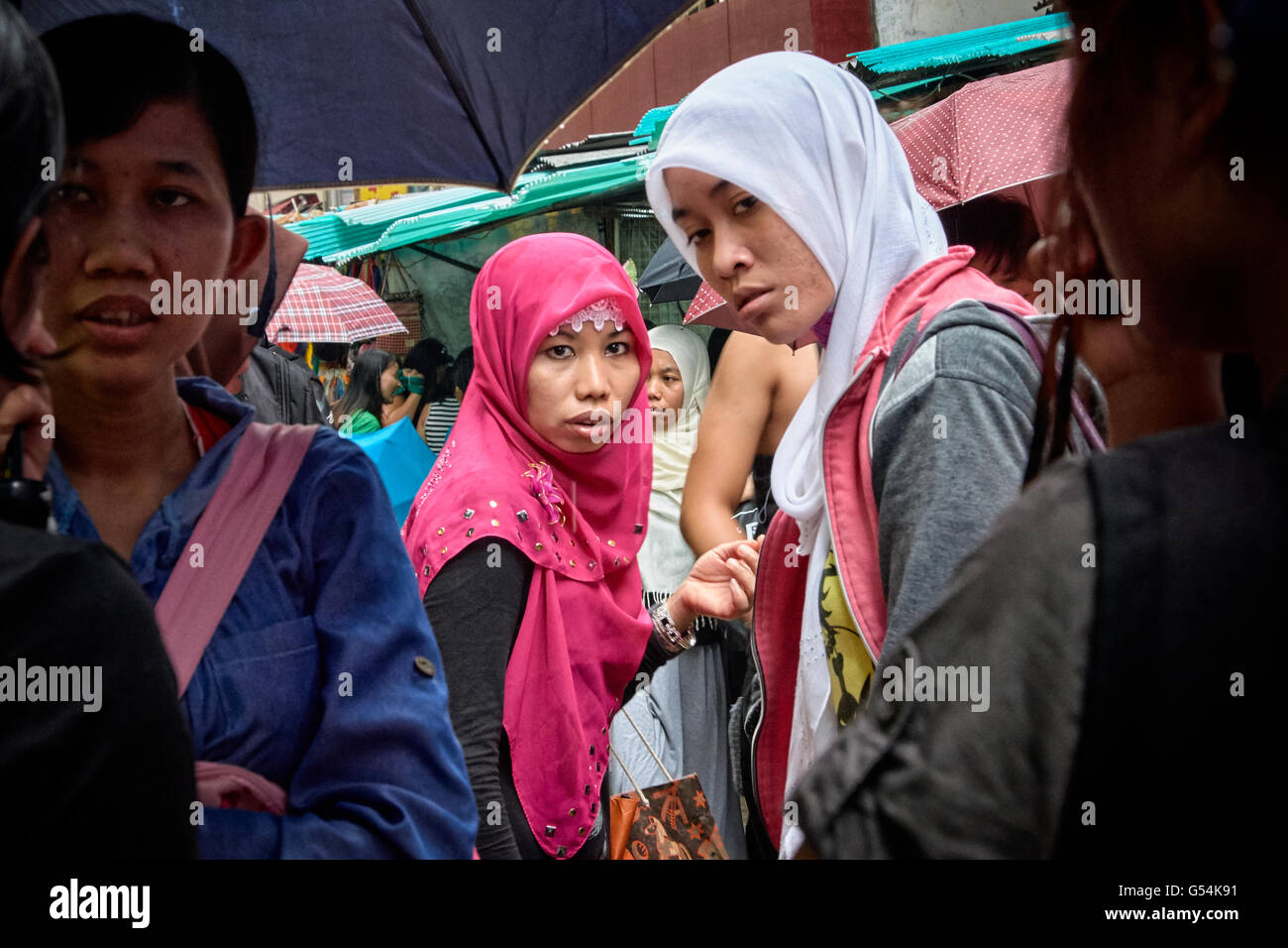 Indonesian domestic helpers shopping on Chun Yeung Street in Northpoint on their day off. Stock Photo