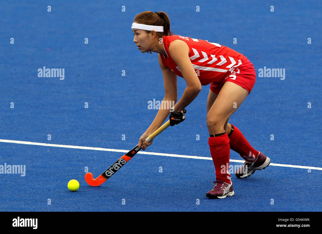 Korea's Hyelyoung Han in action against Argentina during the Visa International Invitational Hockey Tournament at the Riverbank Arena, London. Stock Photo