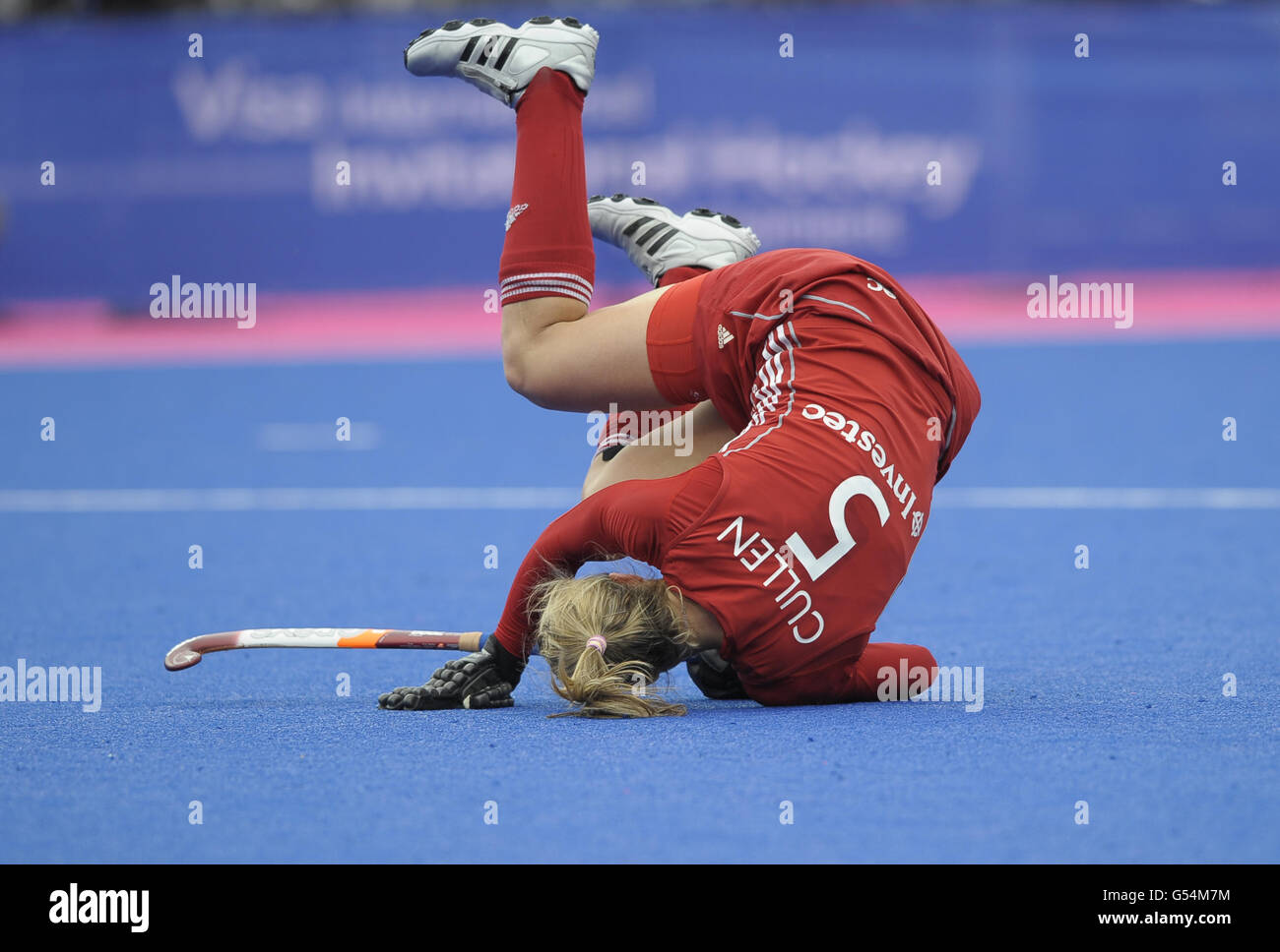 Great Britain's Crista Cullen injures herself after scoring the second penalty during the Visa International Invitational Hockey Tournament at the Riverbank Arena, London. Stock Photo