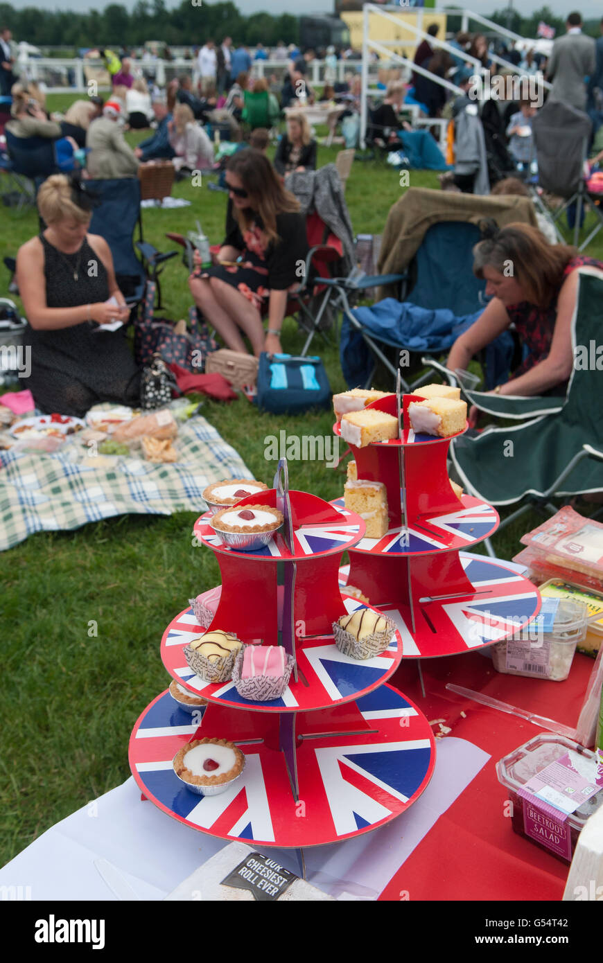 Picnic food Union Jack cake stands at Royal Ascot people in a crowd having a day off away from the office 2010s 2016. UK HOMER SYKES Stock Photo